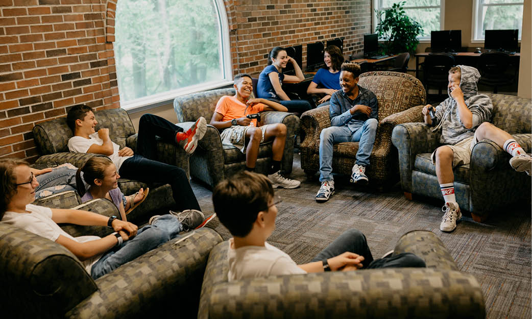 Teens circled up for group time at a residential program at Eagle Village